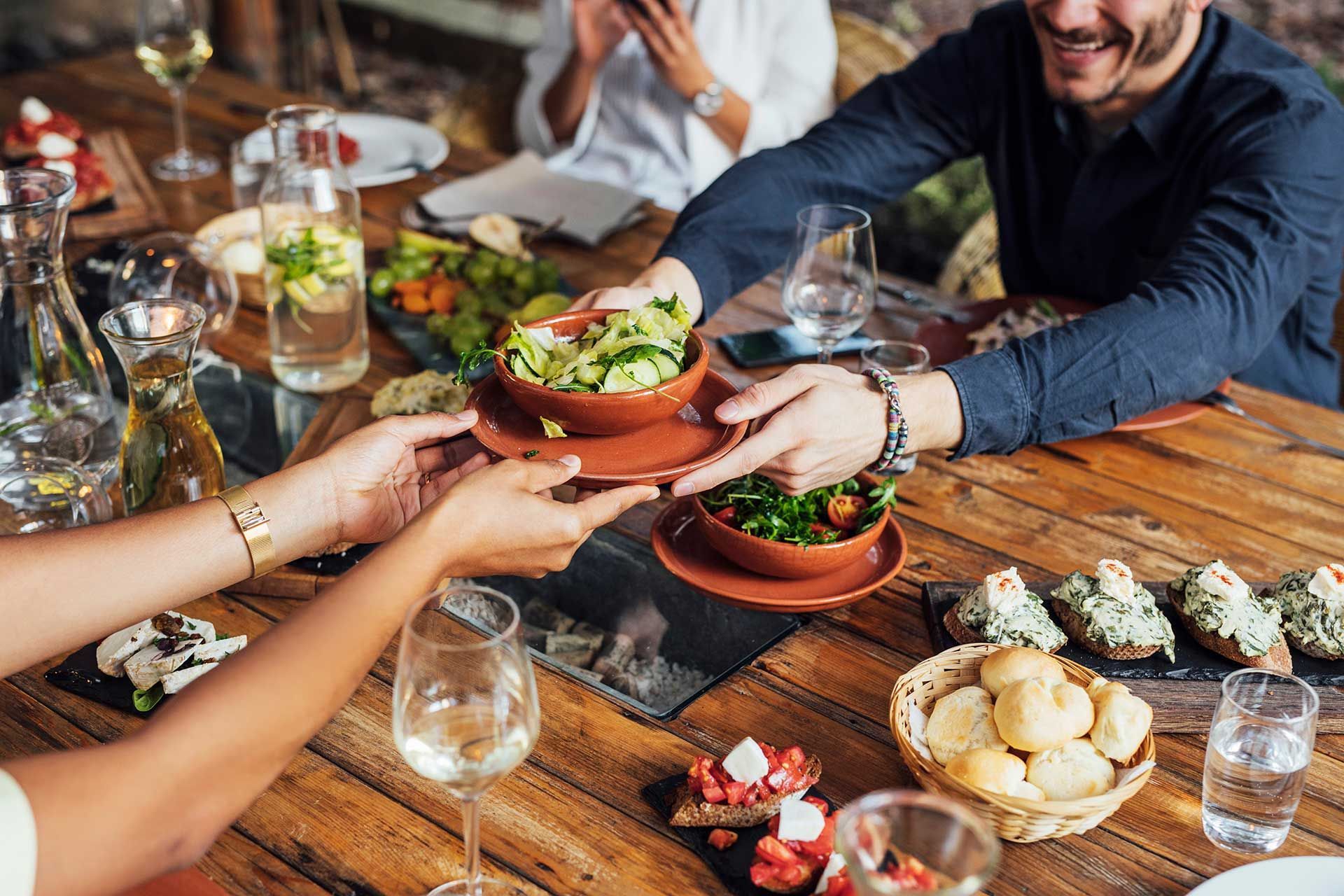 close up of woman in restaurant eating