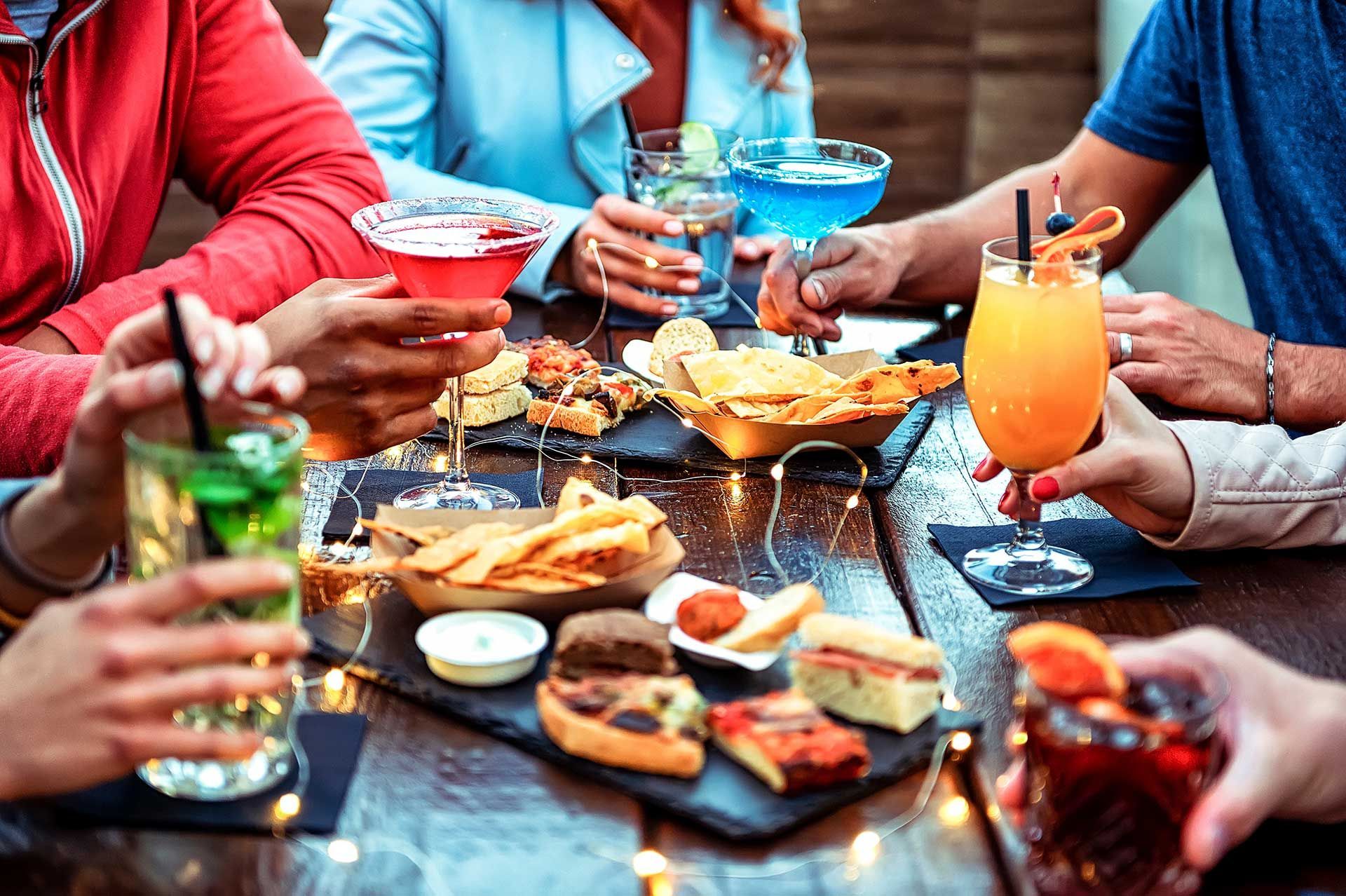 A group of people is dining in a elegance restaurant or hotel 
