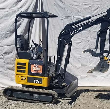 A yellow and black excavator with the number 17g on it