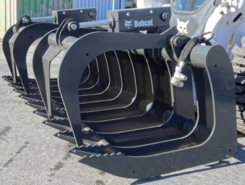 A bobcat tractor with a bucket attached to it