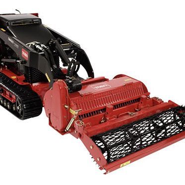 A red and black tractor with a brush attached to it on a white background.
