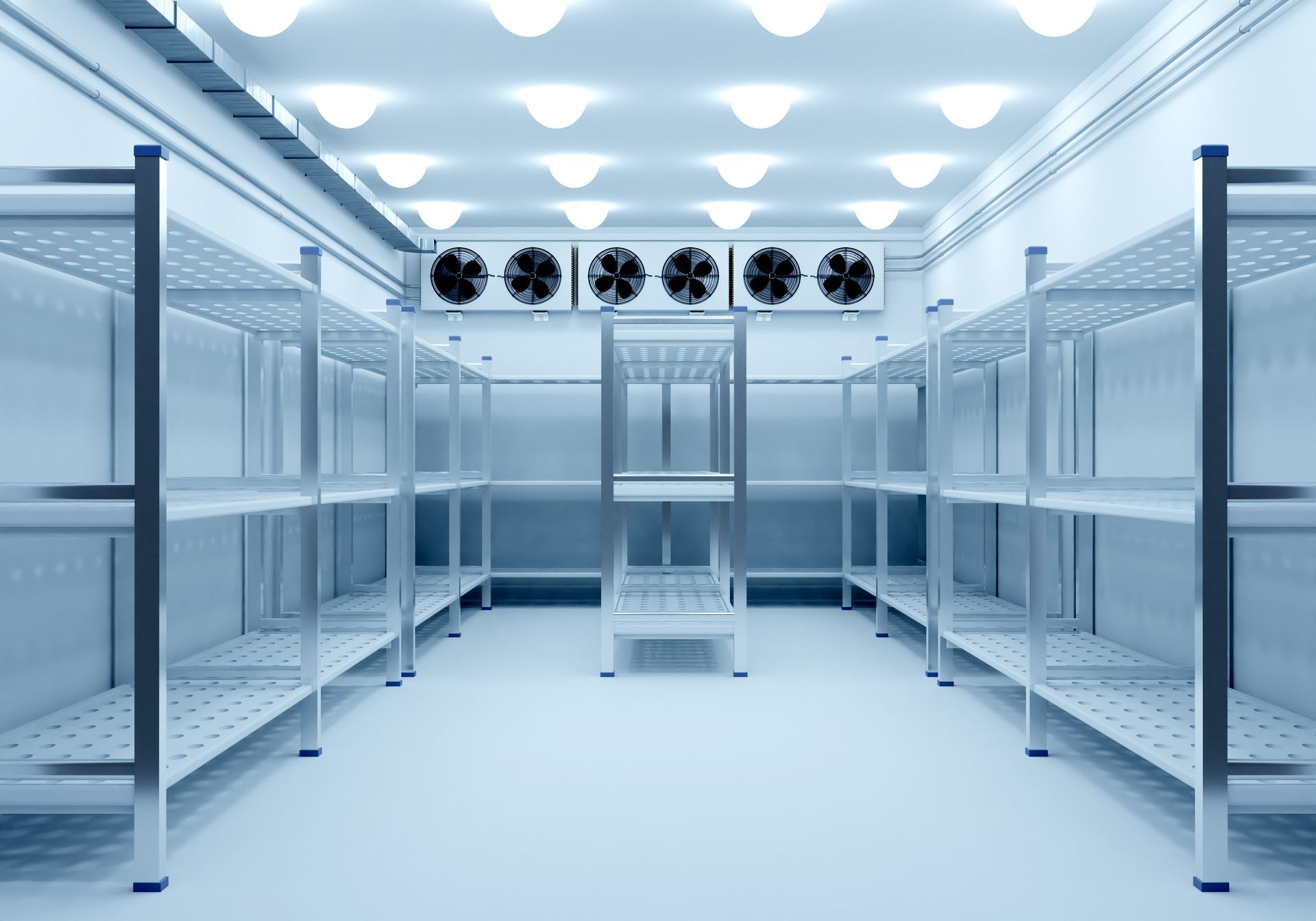 Empty sterile server room with white racks and ceiling fans, lit by bright overhead lights Empty sterile server room with white racks and ceiling fans, lit by bright overhead lights