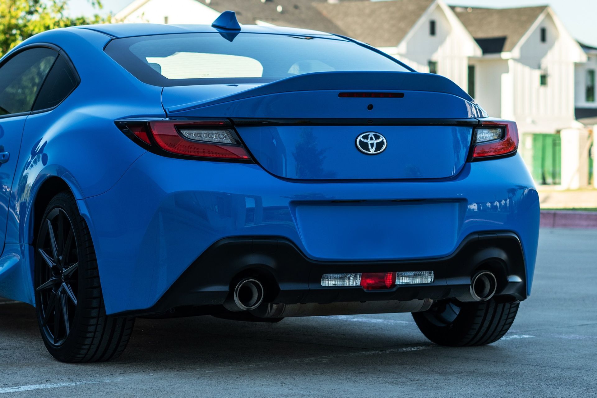 blue car parked in the middle of the street
