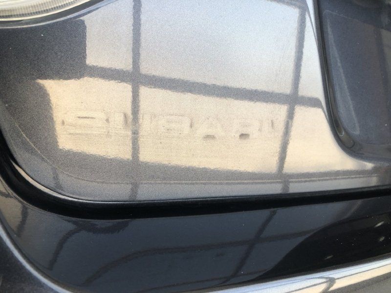 The word subaru is on the back of a car