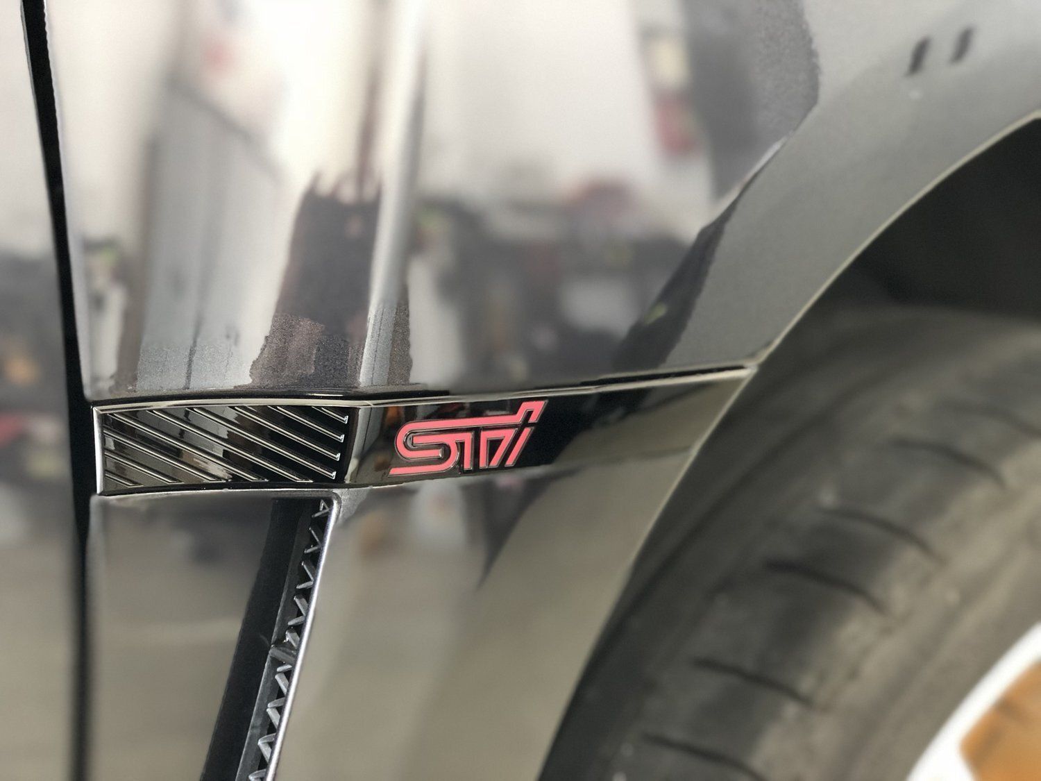 A black car with a s177 emblem on the side