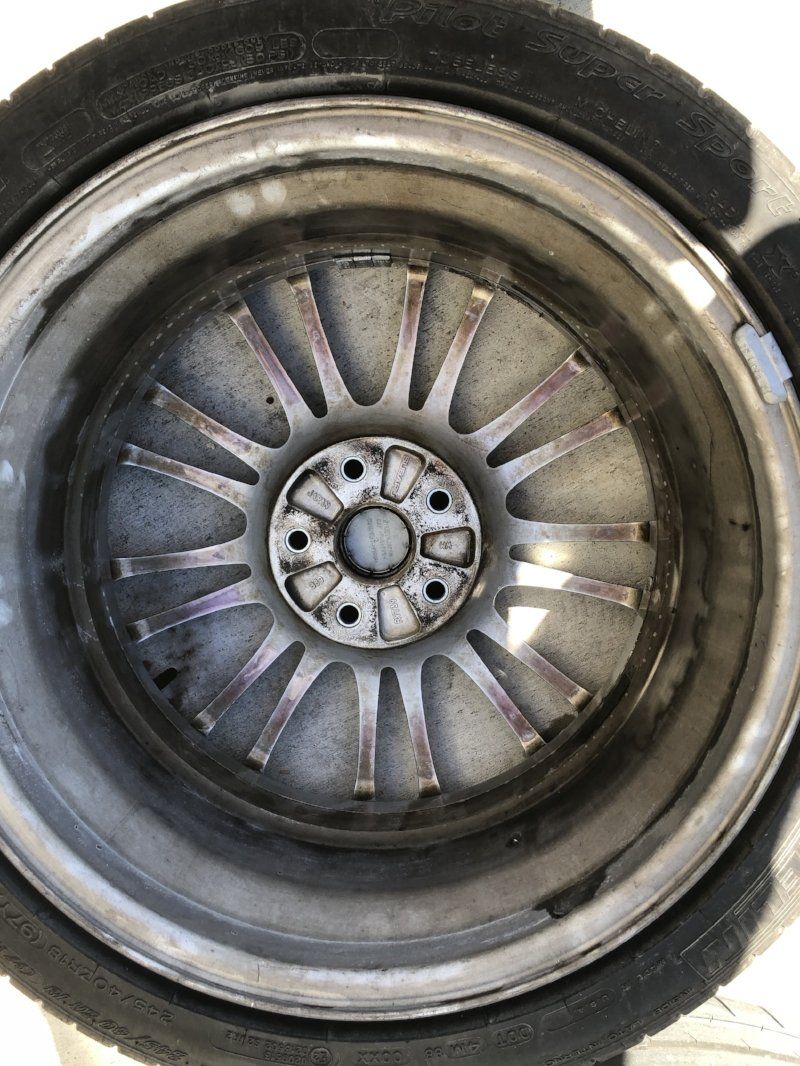 A close up of a car wheel with a tire on it.