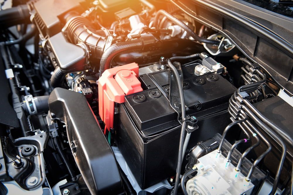 A Close Up Of A Car Engine With A Battery In It — Macgregor Auto In Belconnen, ACT