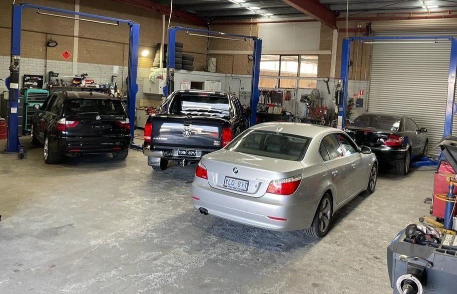 A Group Of Cars Are Parked In A Garage — Macgregor Auto In Belconnen, ACT