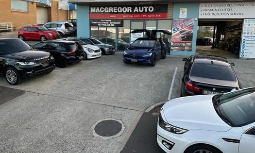 A Lot Of Cars Are Parked In Front Of A Car Dealership — Macgregor Auto In Belconnen, ACT