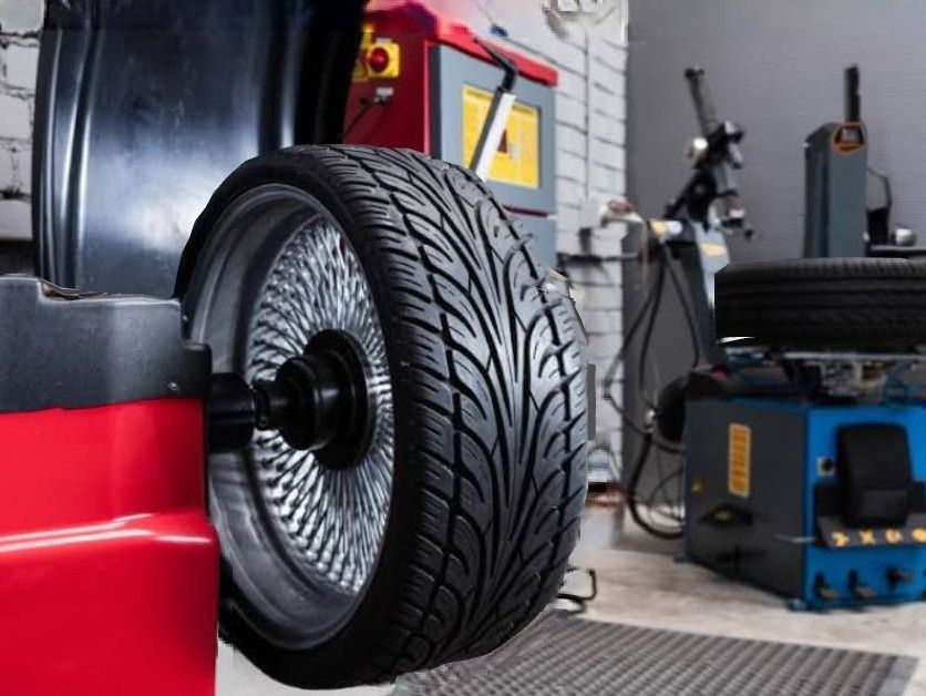 A Tire Is Being Balanced On A Machine In A Garage — Macgregor Auto In Belconnen, ACT