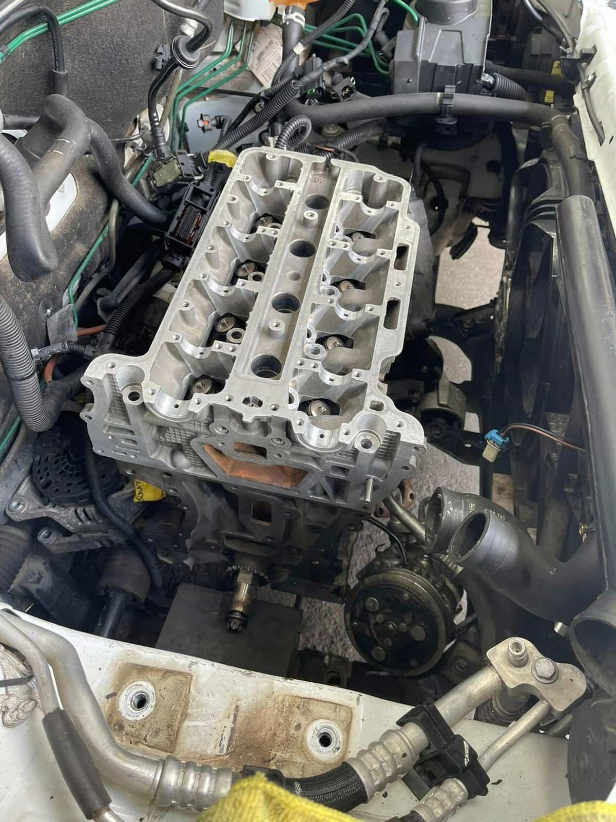 A Close Up Of A Car Engine With The Hood Open — Macgregor Auto In Belconnen, ACT