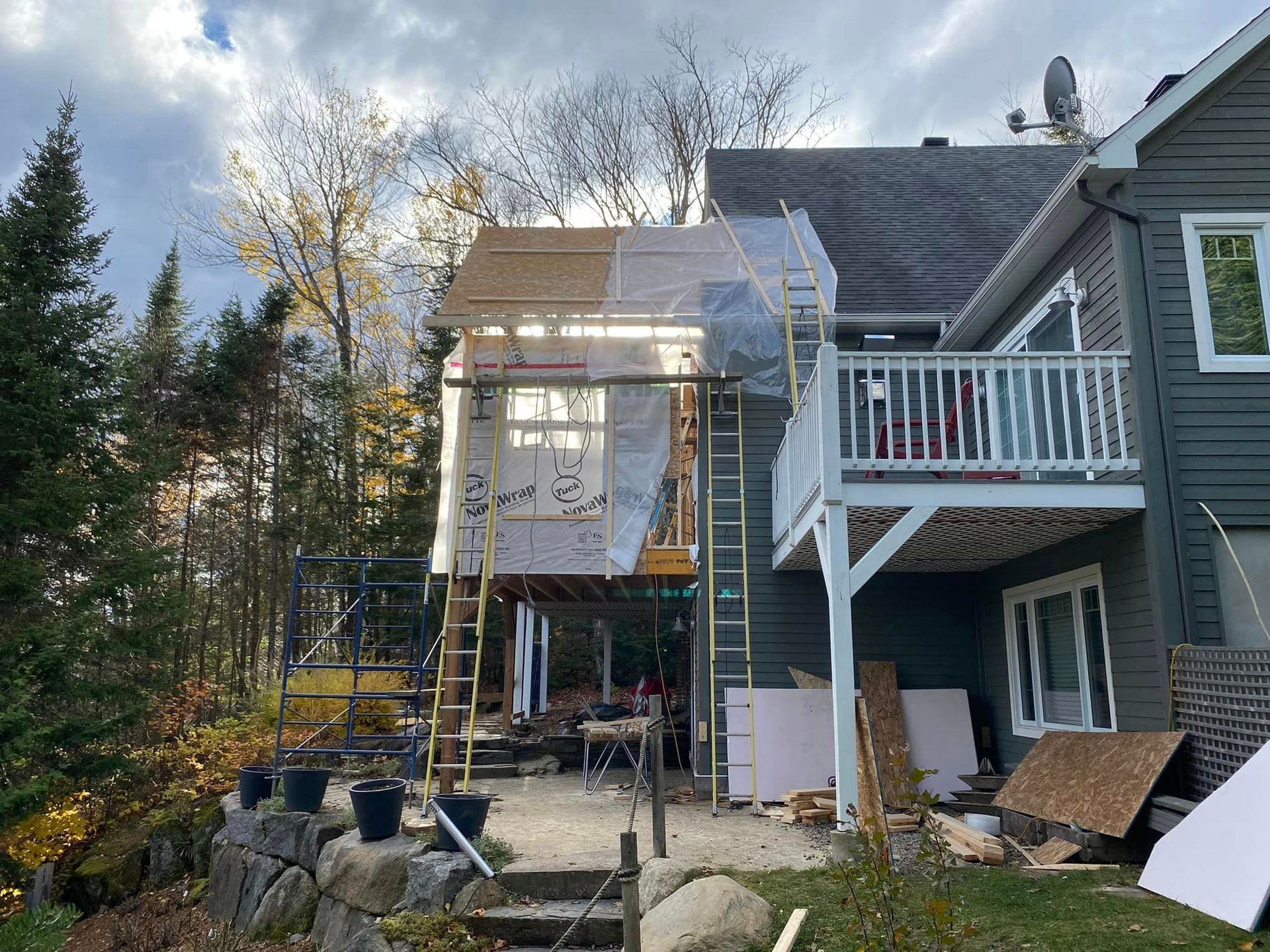 A house with a balcony is being remodeled.