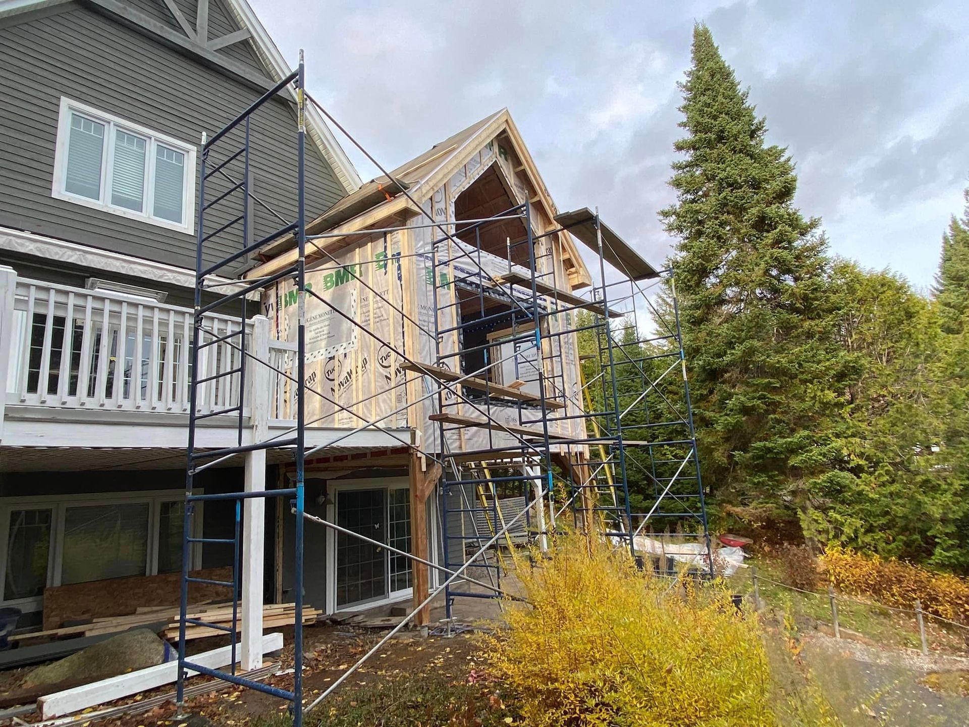 A house is being built with scaffolding around it.