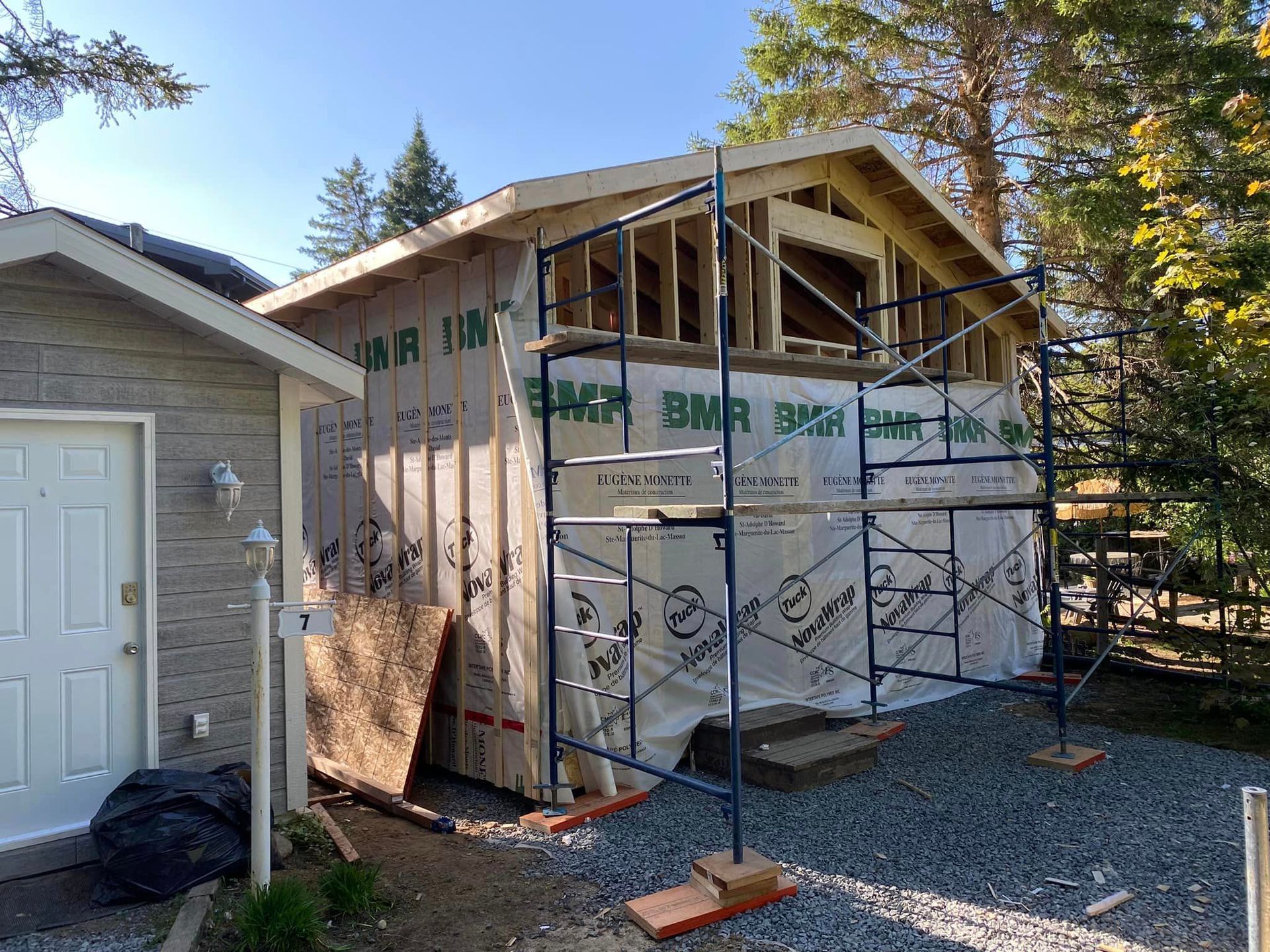 A house is being built with scaffolding around it.