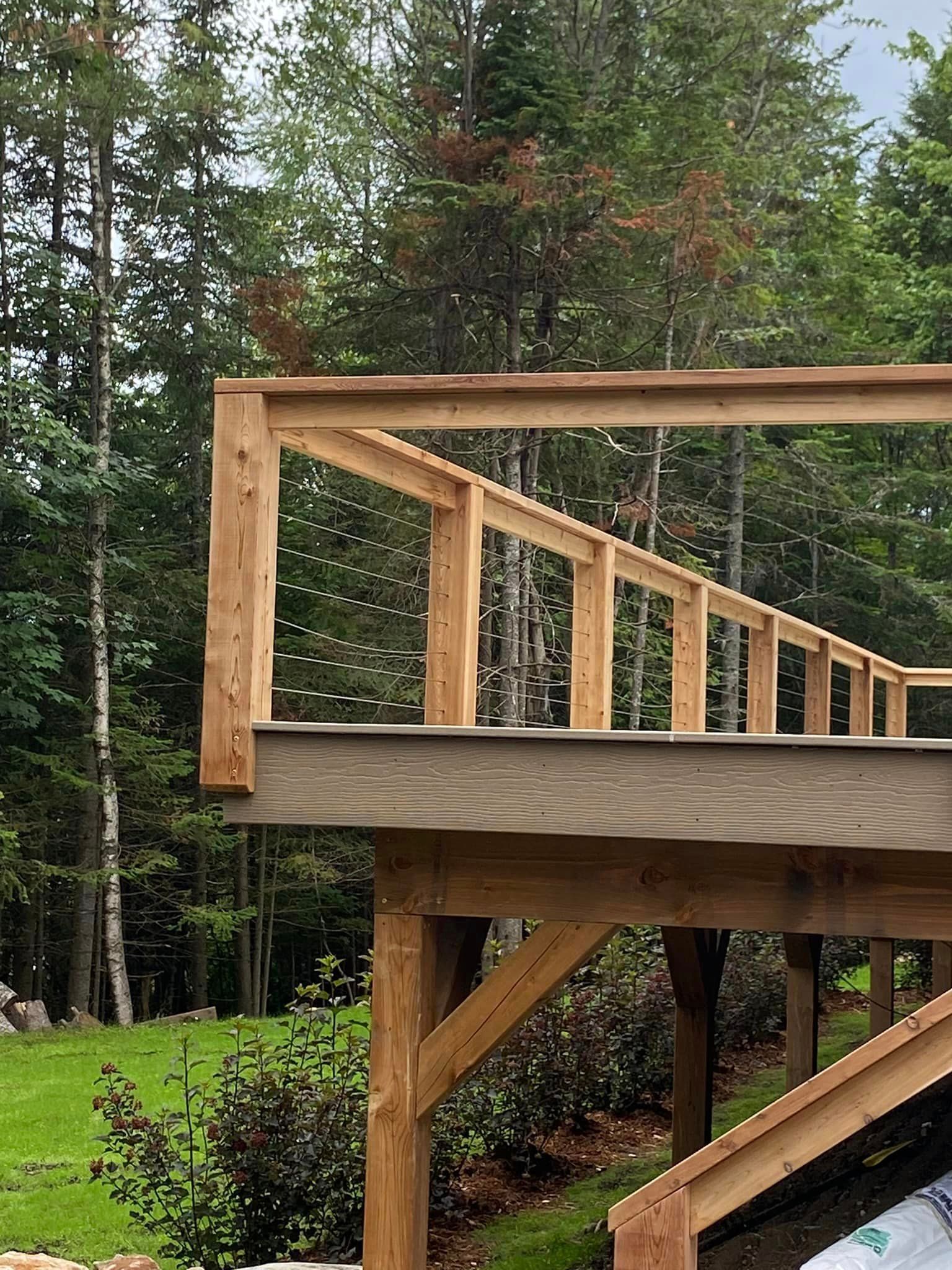 A wooden deck is being built in the middle of a forest.