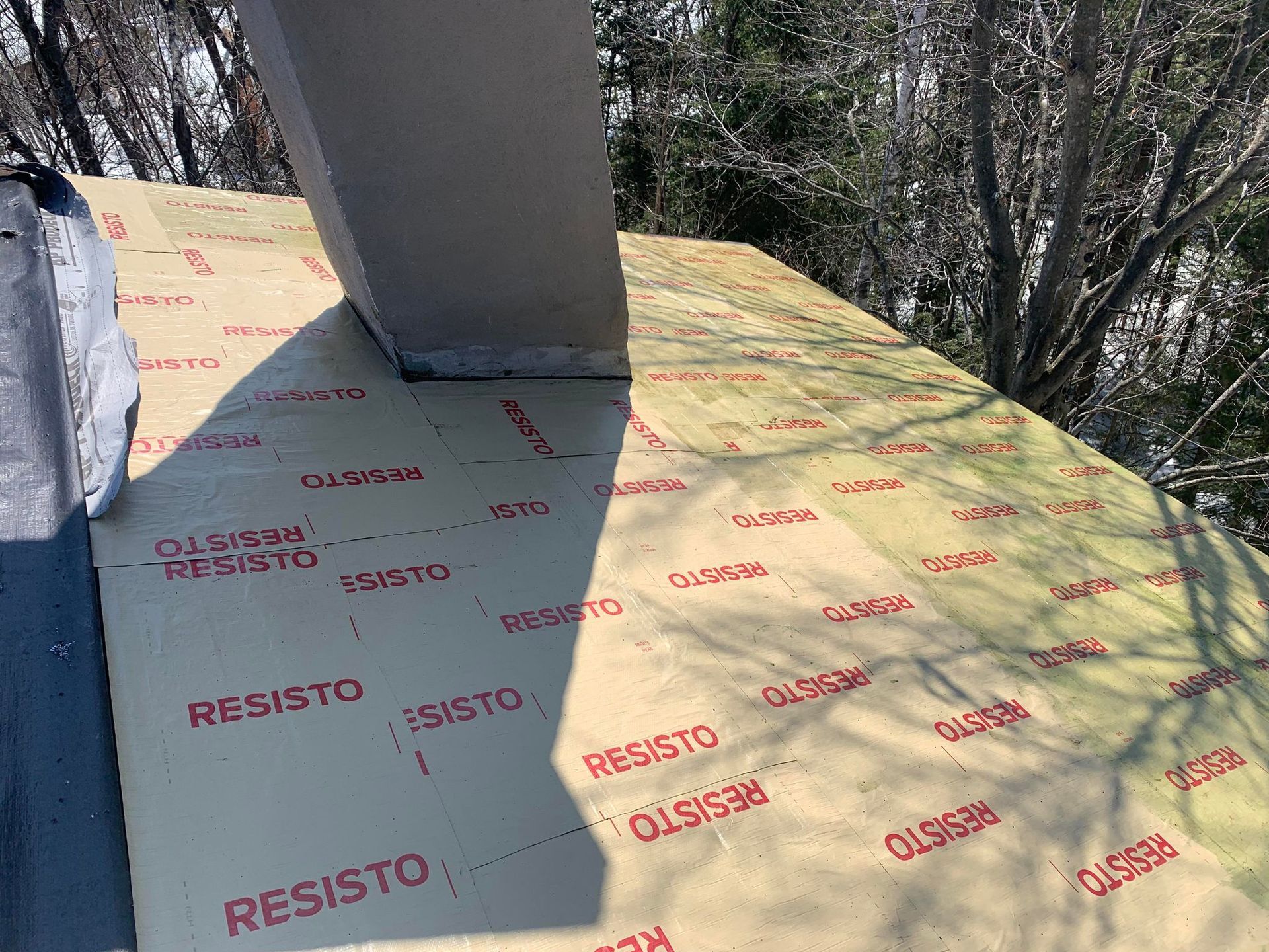 A roof with a chimney sitting on top of it.