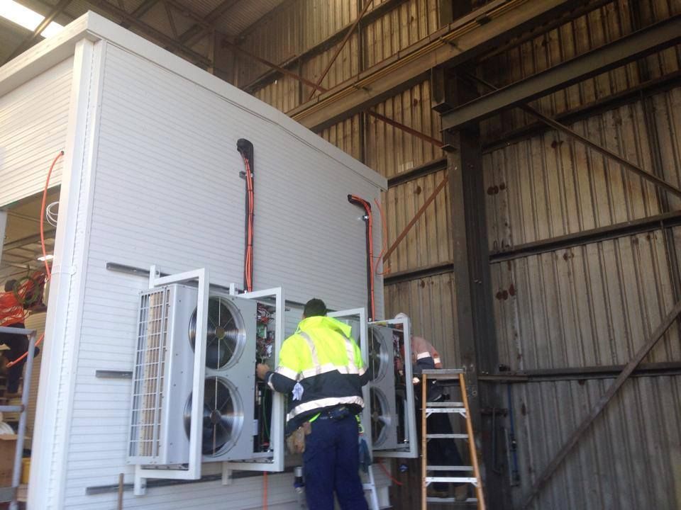 Man Checking Air Conditioner — Energy Efficient Air Conditioning Hunter Valley