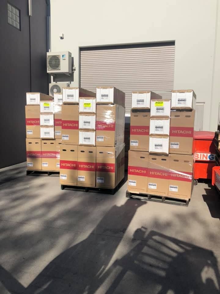 A bunch of boxes are stacked on top of each other — Air Conditioning Lake Macquarie