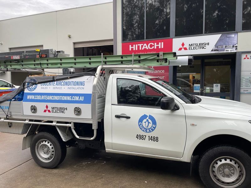 Service Vehicle in Front of the Store — Air Conditioning Service Near Me in NSW