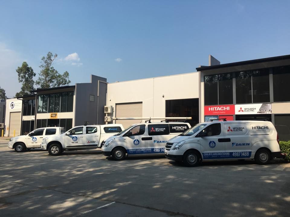 A row of vans parked in front of a building — Air Conditioning Installer Hunter Valley
