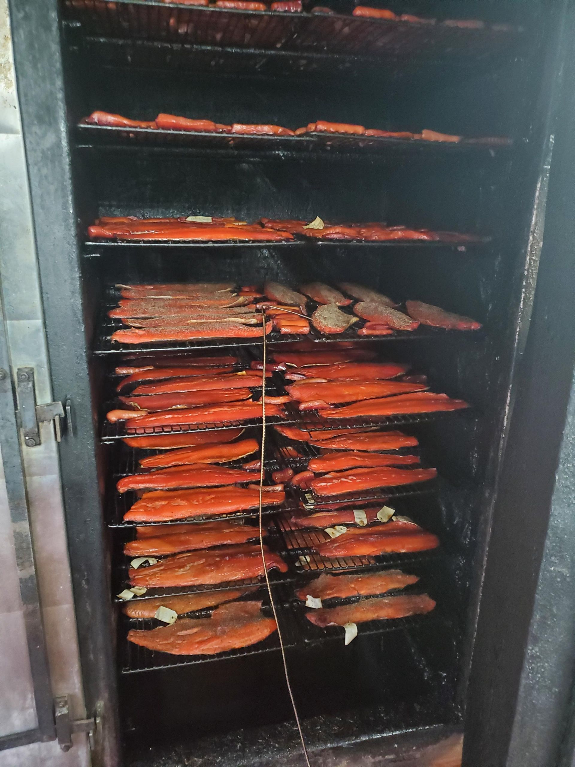 Man Showing the Smoked Products — Port Angeles WA —  Sunrise Meats