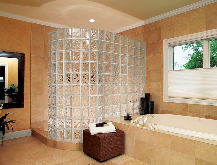 A bathroom with a tub and a walk in shower