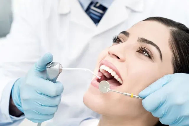 Women Having Teeth Examined At The Dentist - Atlanta, GA - Downtown Dental Center
