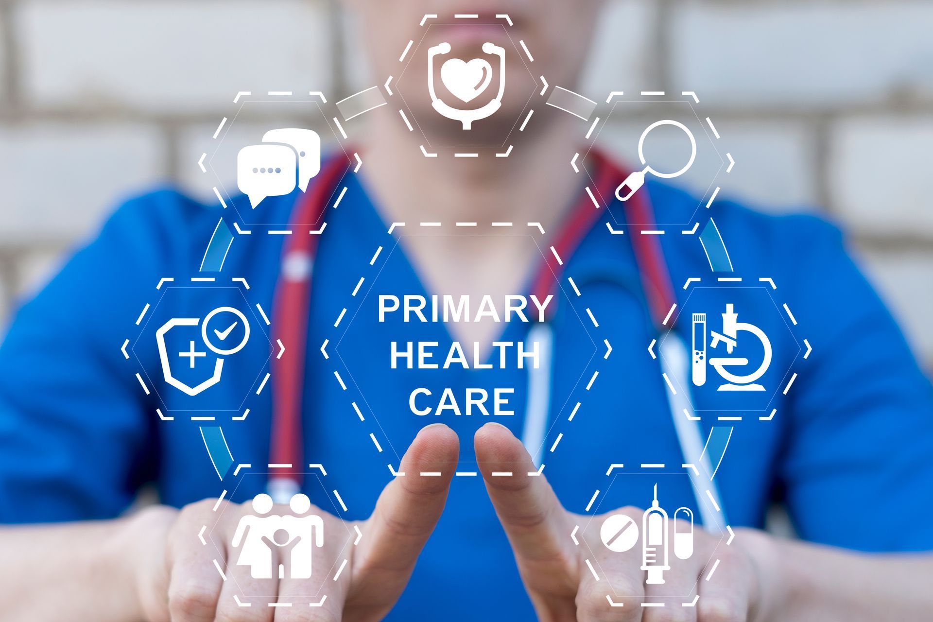 Doctor in blue scrubs with stethoscope pointing at digital primary health care icons