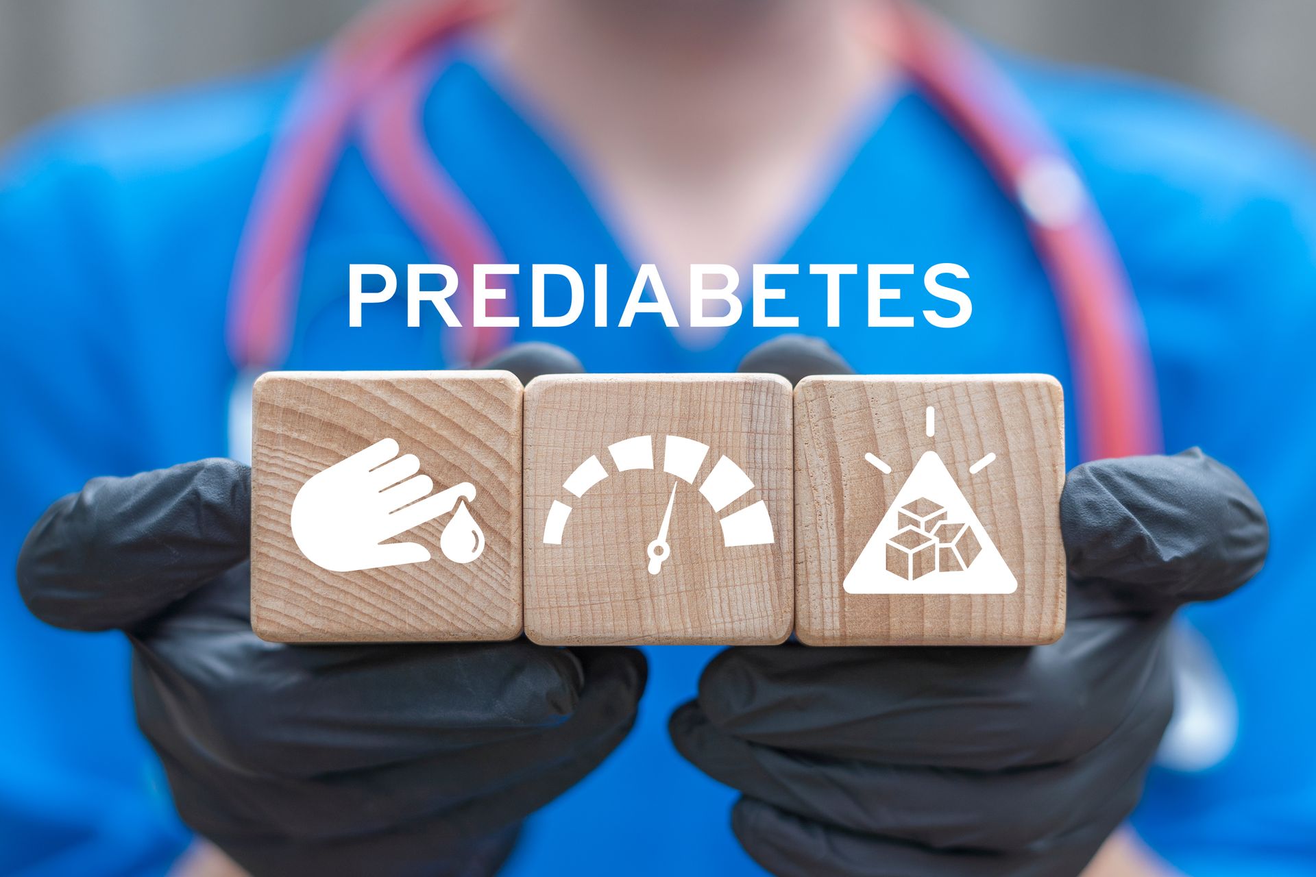 Gloved hands holding blocks labeled prediabetes with healthy diet, glucose meter, and diabetes risk icons