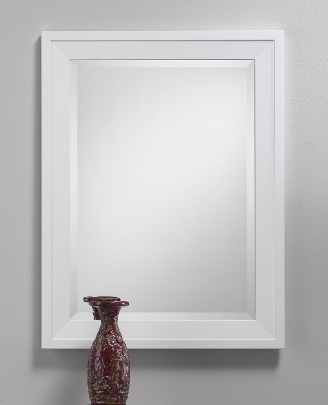 White framed mirror above a small dark red vase against a light gray wall
