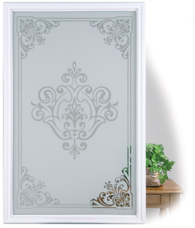 Decorative frosted glass door with ornate floral patterns, partly open in a bright interior.