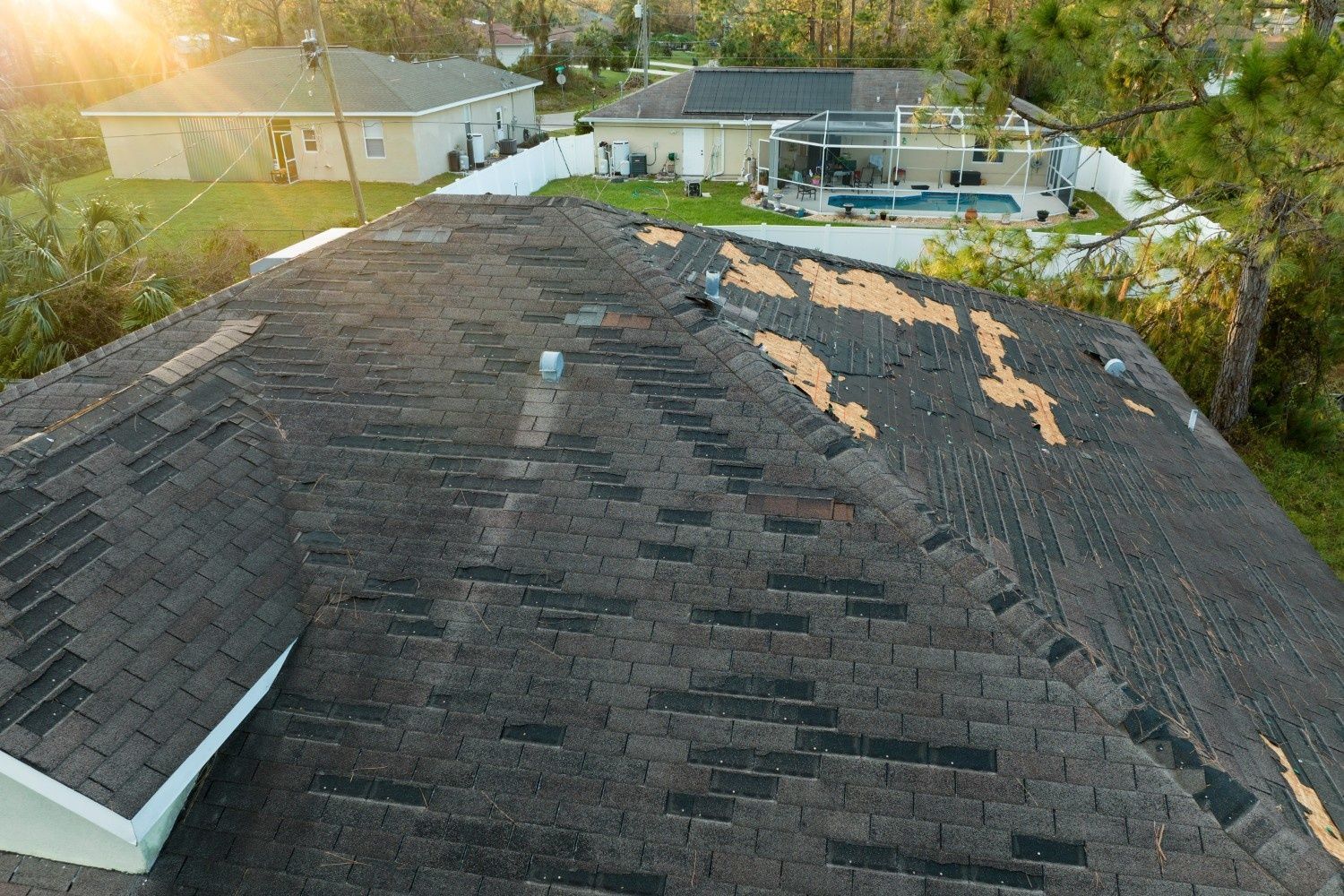 Damaged Asphalt Shingle Roof of A House with Missing Shingles — Geoff Hall Roofing in Mid North Coast, NSW