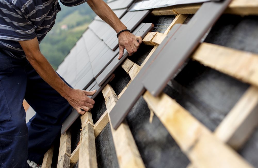 Roofer Installing Roof Tiles