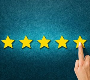 A hand points to the fifth yellow star in a row of five, symbolizing a top rating against a textured blue background.