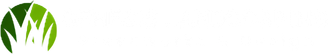 A circular logo featuring stylized green grass blades against a shaded, circular background.