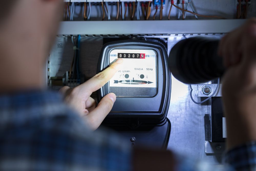 Person Pointing at a Meter — EBS NQ Electronic Building Systems in Kirwan, QLD