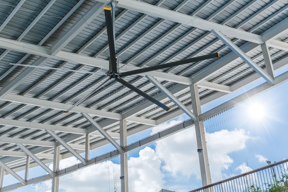 Large Black Ceiling Fan Suspended From a Metal Roof — EBS NQ Electronic Building Systems in Kirwan, QLD