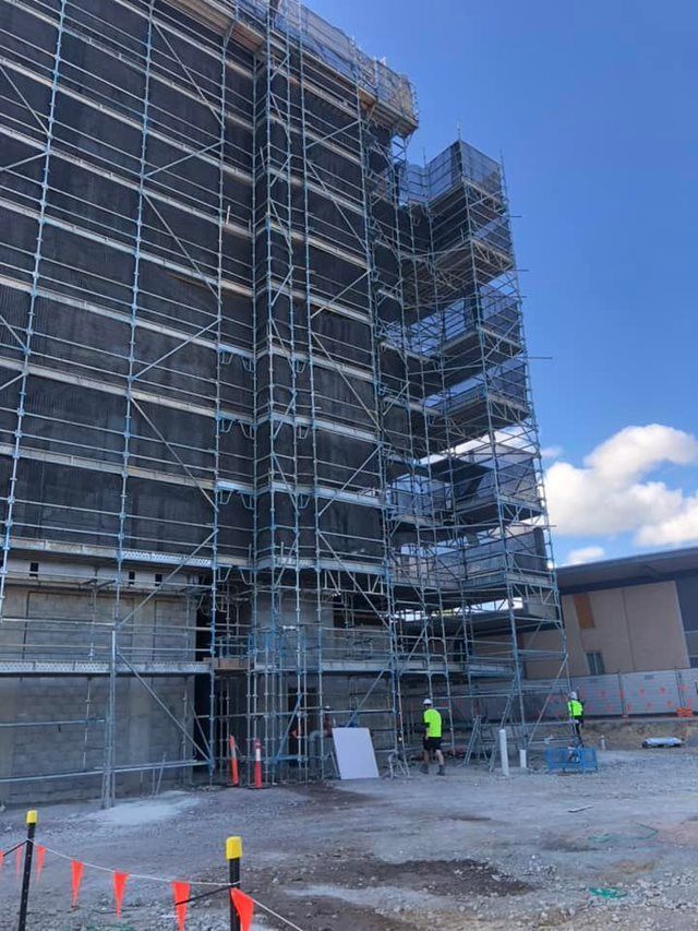 Scaffolding on a Building Under Construction, Workers Present — EBS NQ Electronic Building Systems in Kirwan, QLD