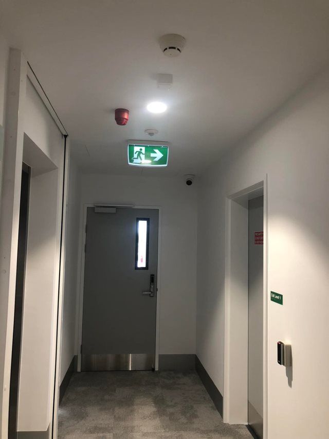 Hallway With Exit Sign, Fire Alarm — EBS NQ Electronic Building Systems in Kirwan, QLD