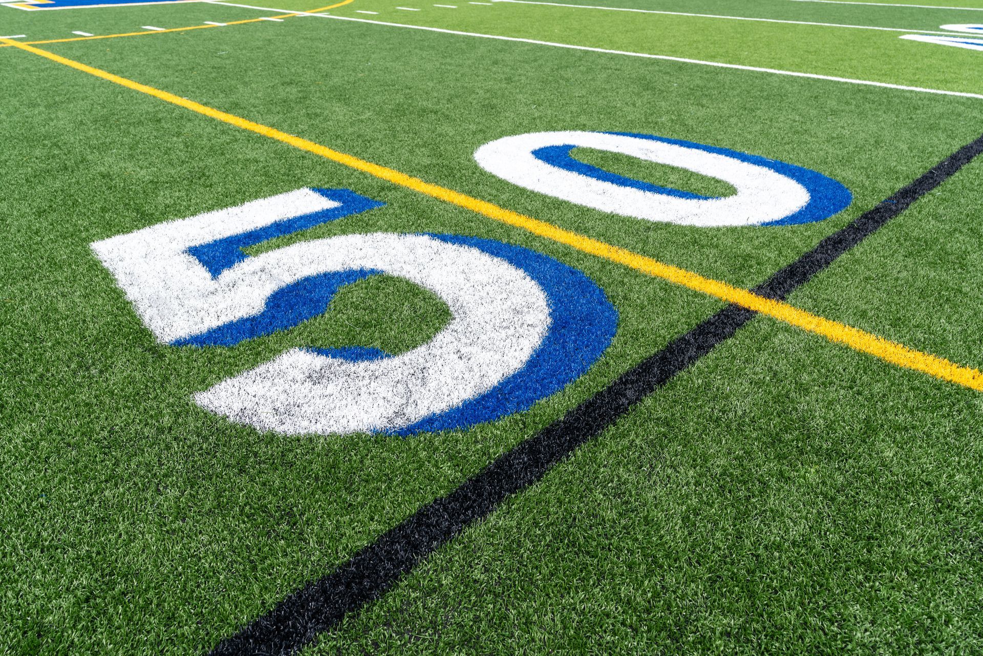Baseball on a dark surface, with visible stitching.