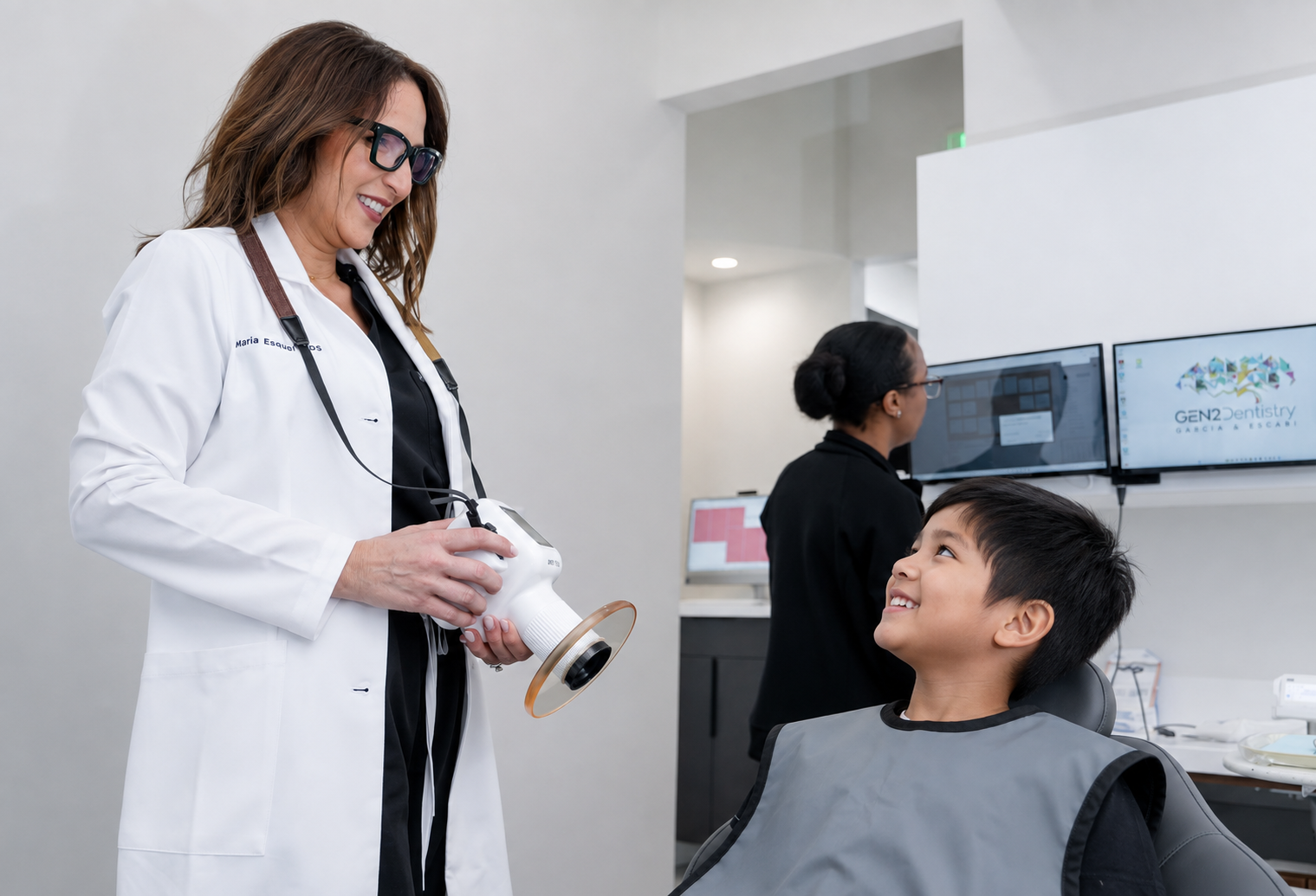 Dentist showing a dental X-ray to a smiling patient in a clinic room