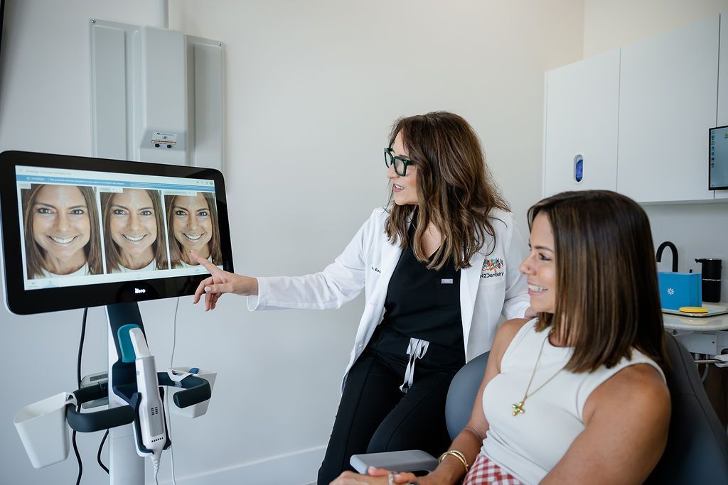 Consultation in a clinic: clinician points to facial images