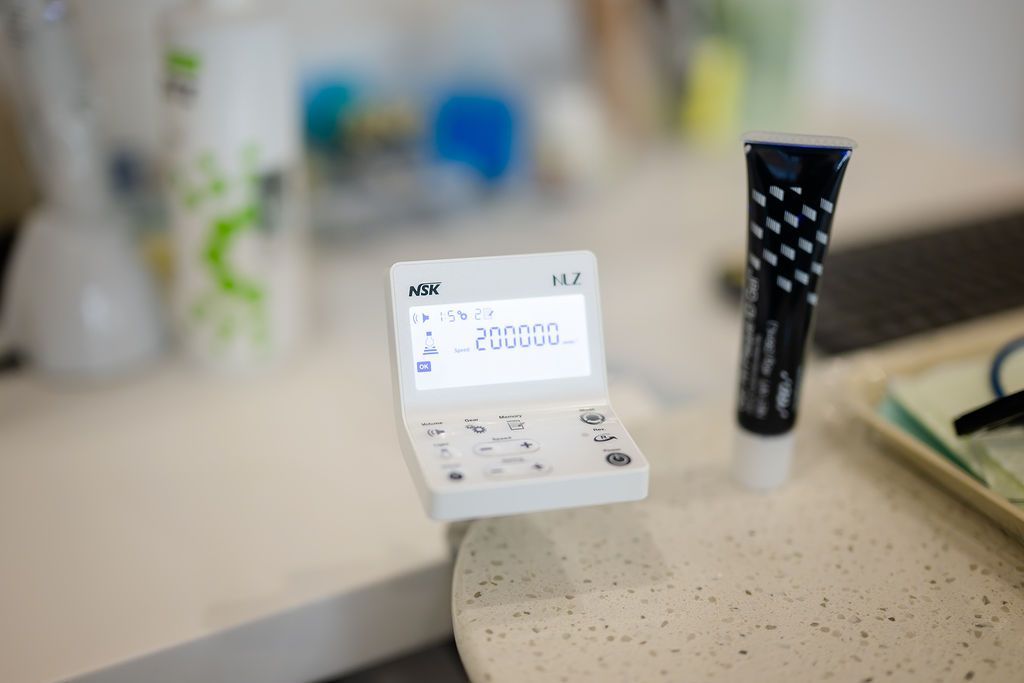 Digital control unit for a dental handpiece on a treatment room counter