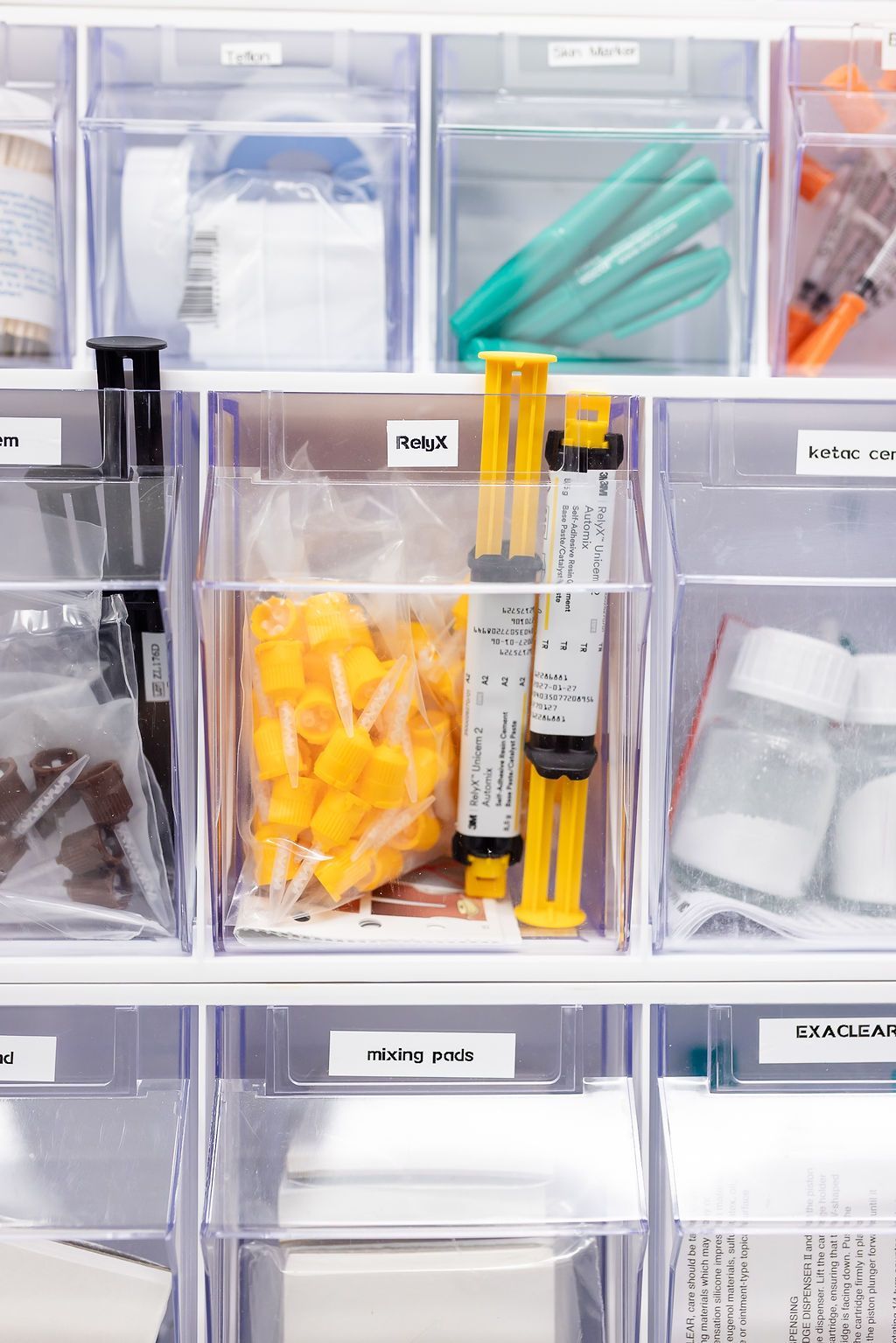 Organized dental supplies in labeled bins at GEN2 Dentistry