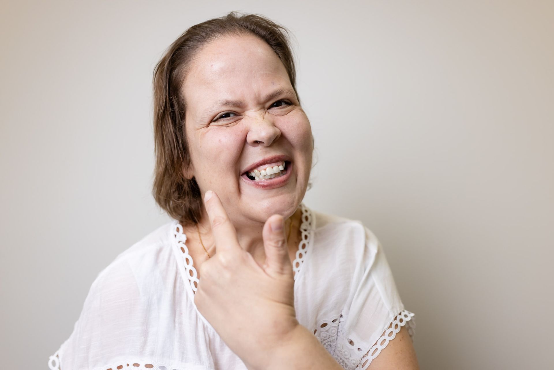 Smiling patient showing off a finished cosmetic smile in Davie, FL