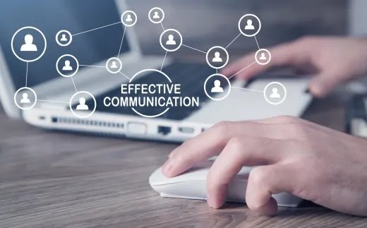 Hands using a laptop and mouse with “Effective Communication” network icons overlayed on screen