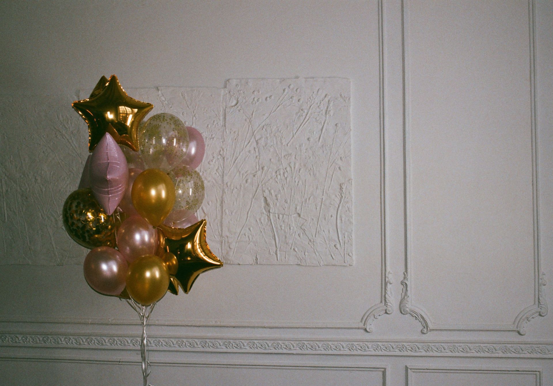 Illustrative gold celebration balloons