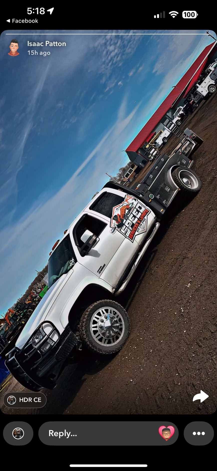A white pickup truck with a utility bed parked on a gravel lot under a bright blue sky.