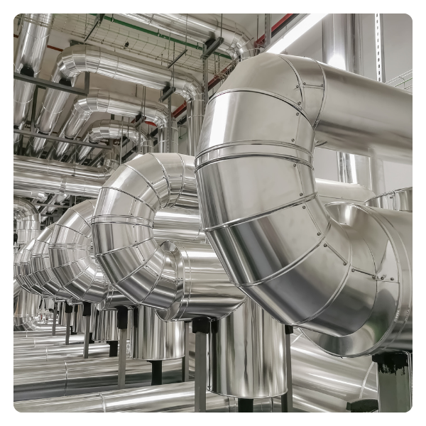 Insulated metal pipes in an industrial setting.