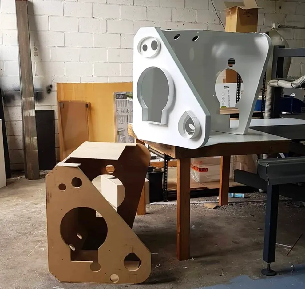 Two Fabricated Parts on a Factory Table — Coastal Plastics In Tweed Heads South, NSW